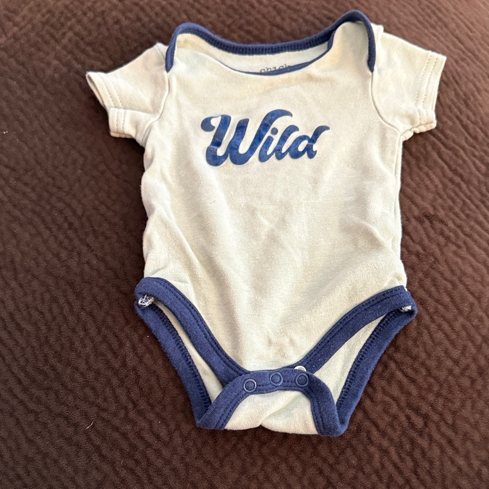 chick pea Cream One-Piece Bodysuit with Blue Trim and "Wild" Graphic